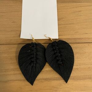 Black cotton feather earrings.